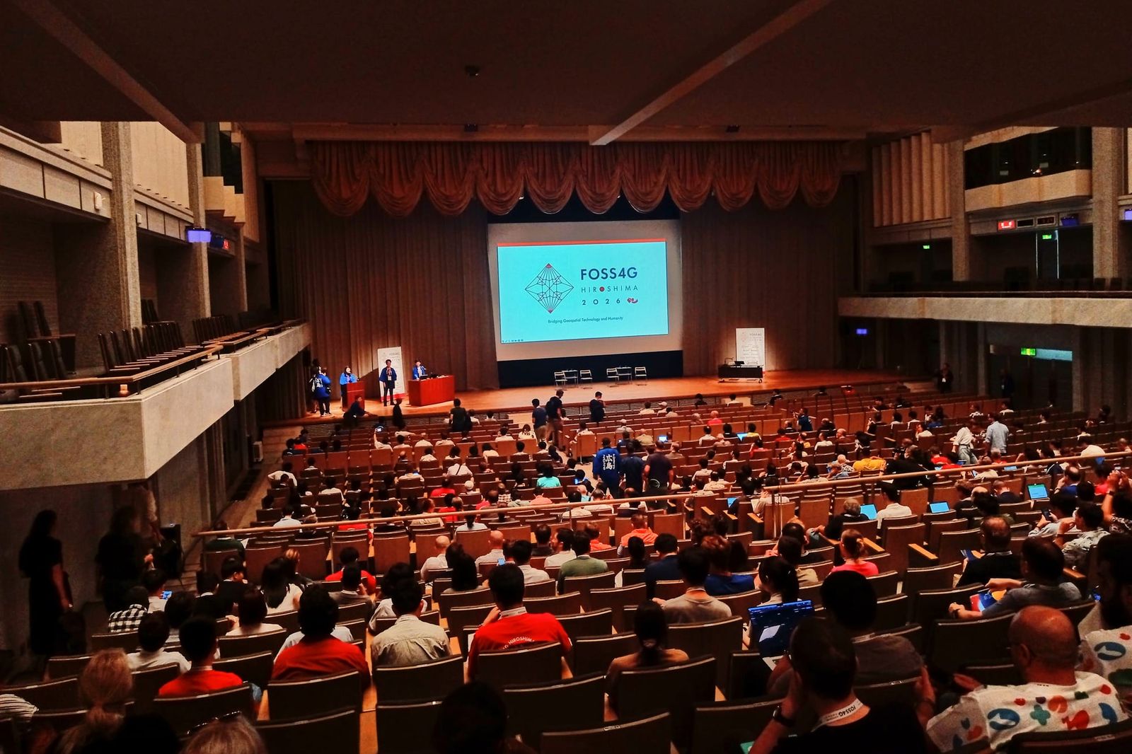 Phoenix Hall, packed with participants at the opening